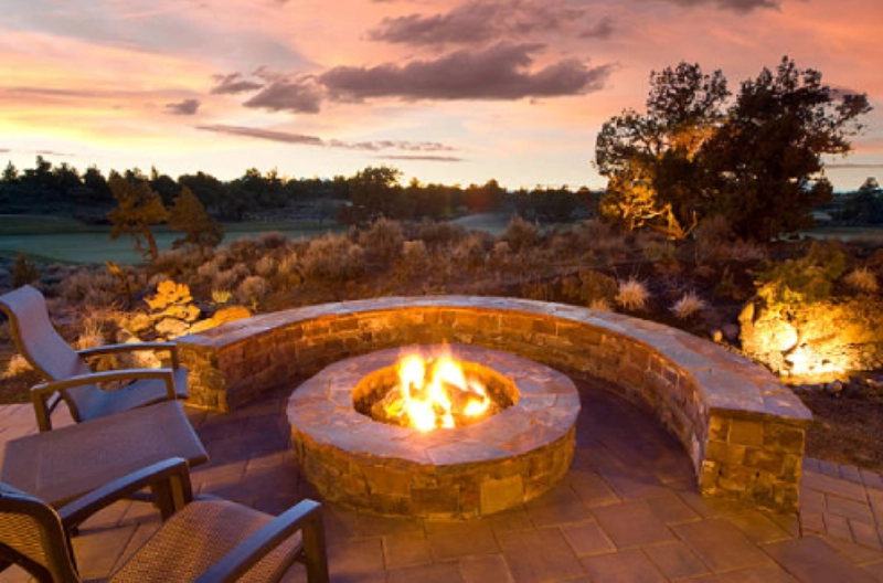 Fire pit with stone seating at sunset