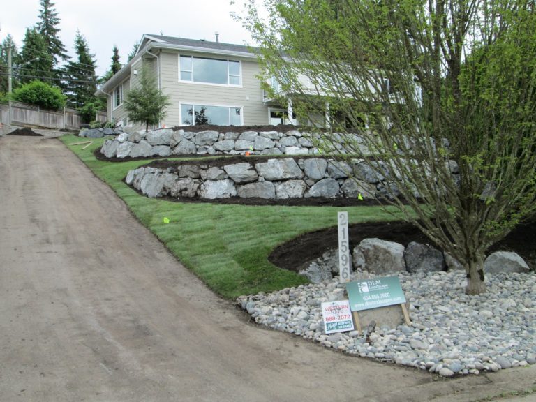 Residential property featuring tiered rock garden