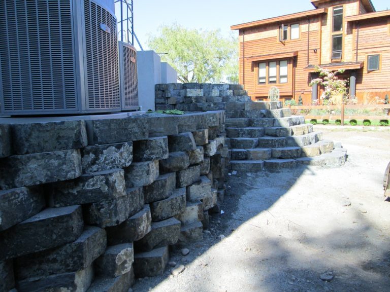 Outdoor stone staircase near wooden house