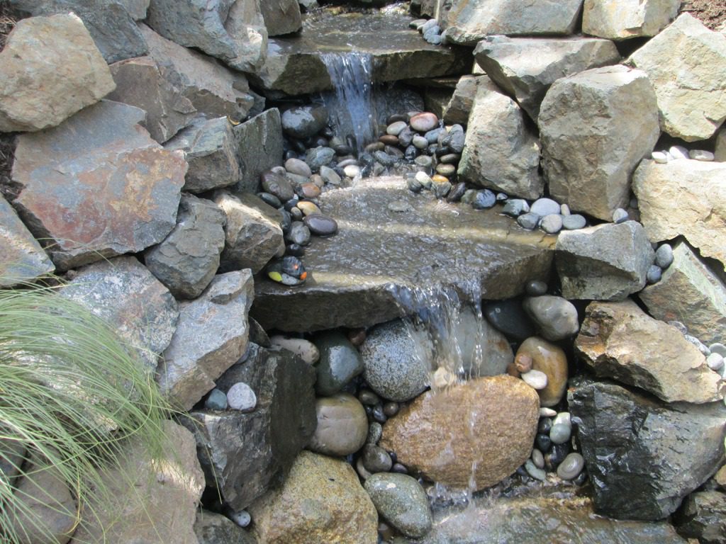 Garden stream with smooth stones